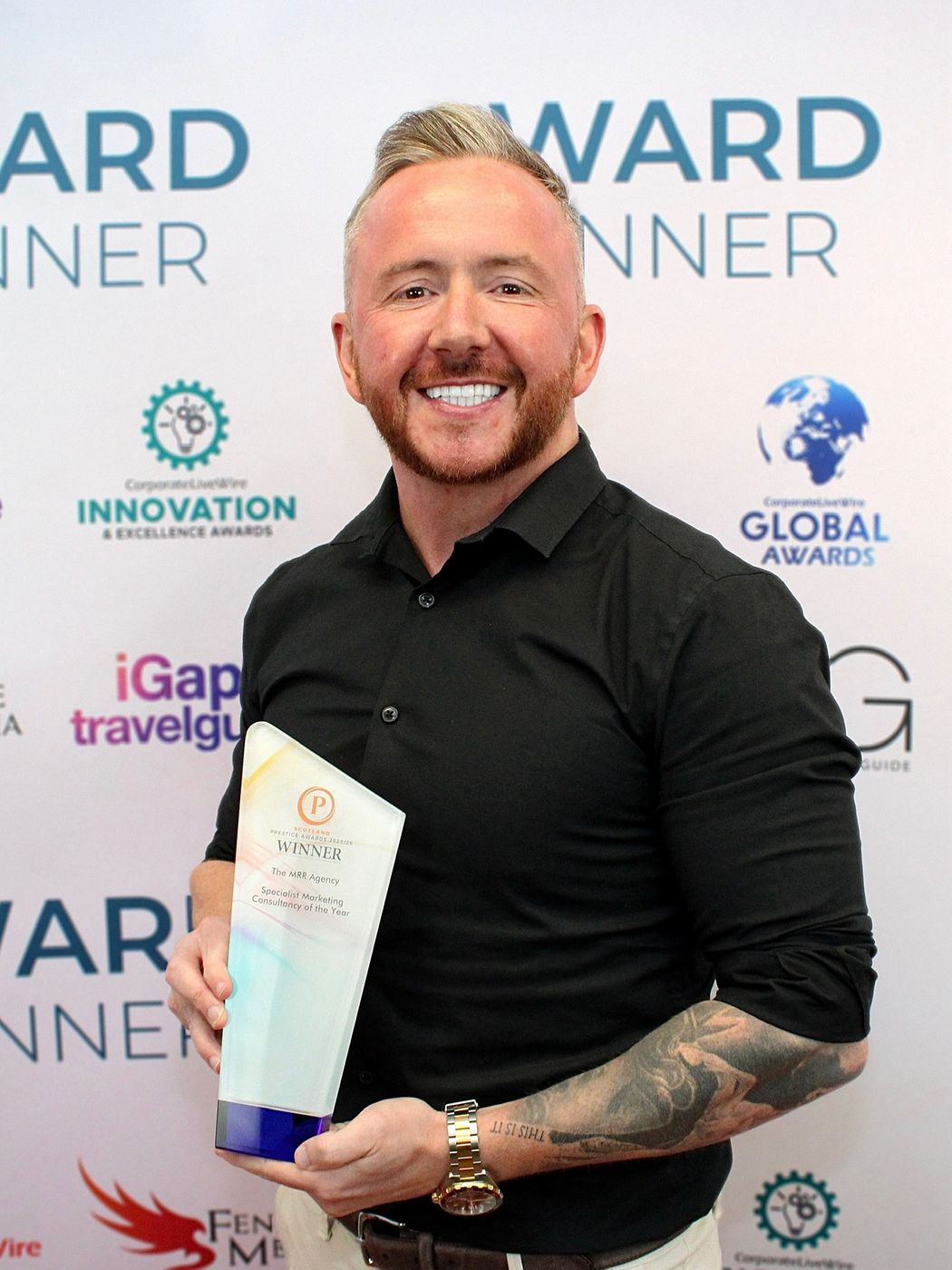 Chris Bradley holding the Specialist Marketing Consultancy of the Year 2025/26 award